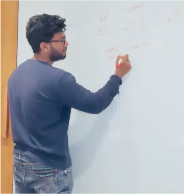 Person using whiteboard to explain something